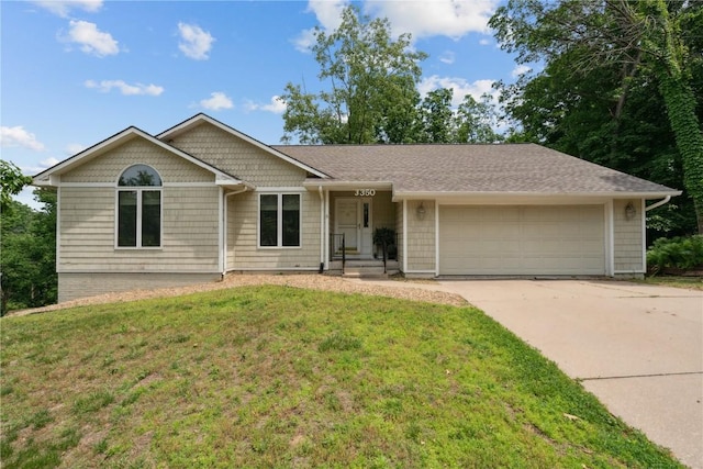 3350 Old Orchard Rd NE, Cedar Rapids, IA 52402 - single story home featuring a garage, driveway, a front lawn, and roof with shingles