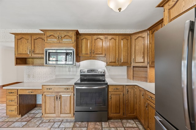 4519 Indian Creek Rd, Marion, IA 52302 - kitchen with stainless steel appliances, light countertops, backsplash, and light stone finish flooring