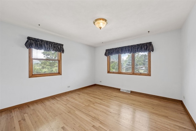 4519 Indian Creek Rd, Marion, IA 52302 - spare room featuring plenty of natural light, light wood-type flooring, and baseboards