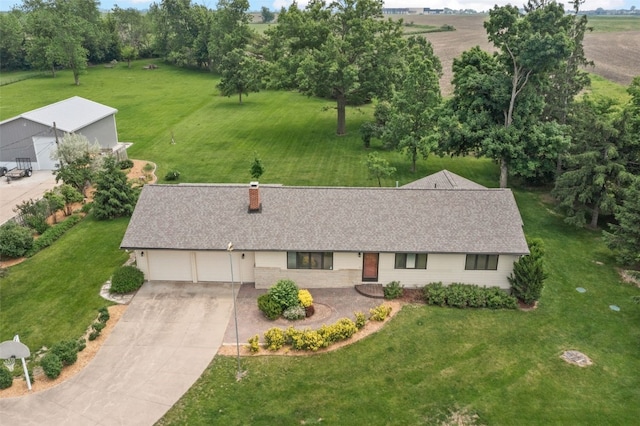 4519 Indian Creek Rd, Marion, IA 52302 - view of front of home featuring driveway, a front lawn, an attached garage, a chimney, and roof with shingles