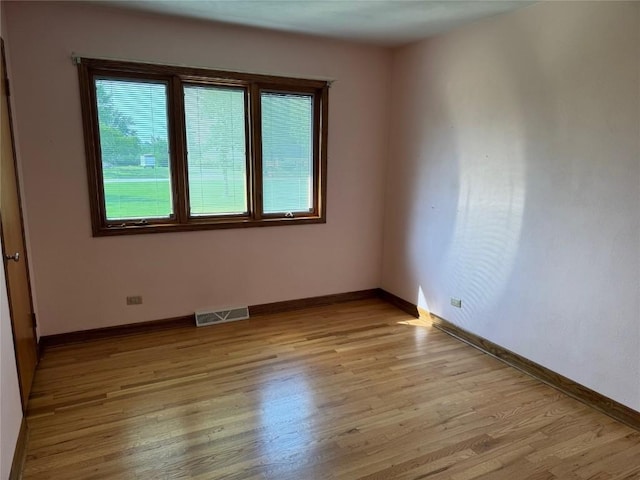 4519 Indian Creek Rd, Marion, IA 52302 - empty room featuring light wood-style floors and baseboards