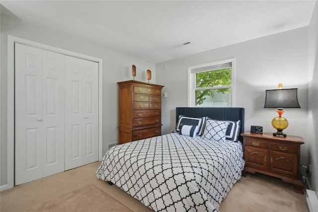 1649 Memorial Dr SE, Cedar Rapids, IA 52403 - bedroom featuring light carpet and a closet