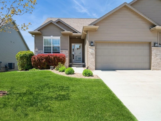 2940 Brookvalley Ct, Marion, IA 52302 - view of front of home with a garage, central AC, a front lawn, driveway, and roof with shingles