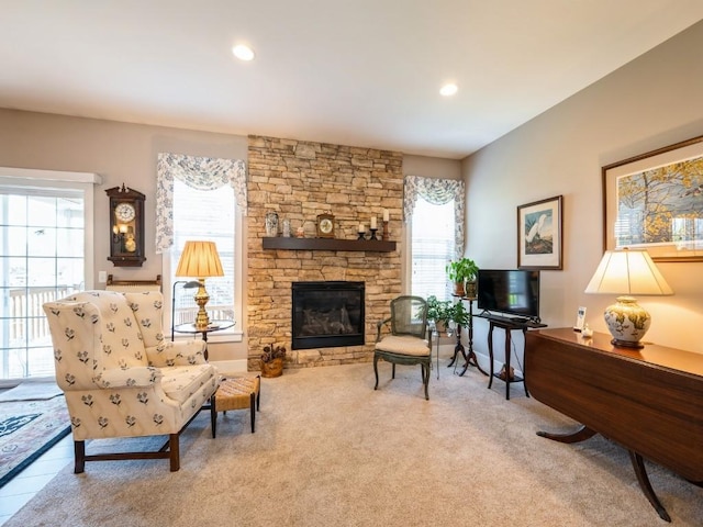 2940 Brookvalley Ct, Marion, IA 52302 - carpeted living room featuring a stone fireplace and recessed lighting