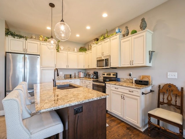 2940 Brookvalley Ct, Marion, IA 52302 - kitchen featuring appliances with stainless steel finishes, a sink, light stone countertops, white cabinets, and recessed lighting