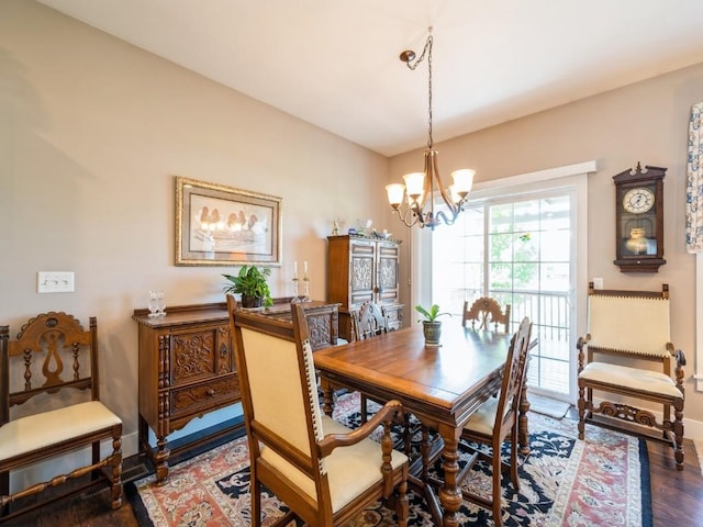 2940 Brookvalley Ct, Marion, IA 52302 - dining room with a chandelier, wood finished floors, and baseboards
