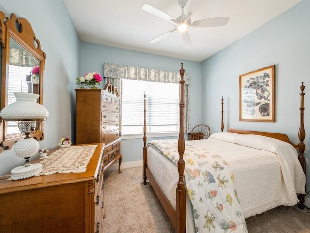 2940 Brookvalley Ct, Marion, IA 52302 - bedroom with light carpet, baseboards, and ceiling fan