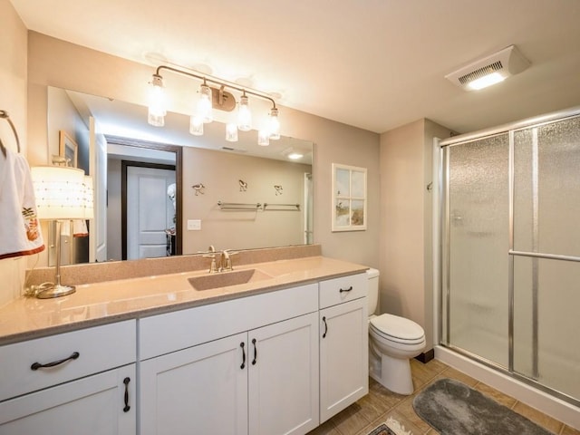 2940 Brookvalley Ct, Marion, IA 52302 - bathroom with a stall shower, vanity, toilet, and tile patterned floors
