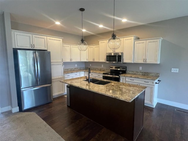 2940 Brookvalley Ct, Marion, IA 52302 - kitchen featuring stainless steel appliances, a sink, baseboards, white cabinets, and light stone countertops