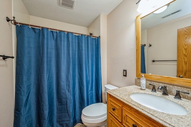 4320 Maureen Ct SE Unit 176, Cedar Rapids, IA 52403 - full bathroom featuring vanity, toilet, a textured ceiling, and a shower with shower curtain