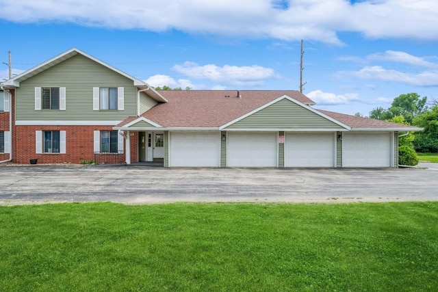 4320 Maureen Ct SE Unit 176, Cedar Rapids, IA 52403 - view of front of home featuring a front lawn, asphalt driveway, brick siding, and roof with shingles