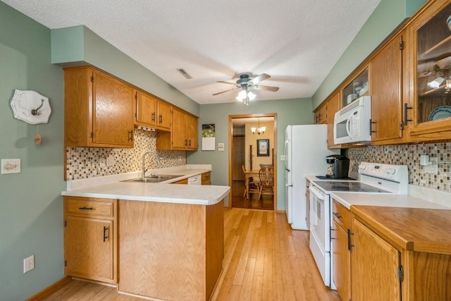 4320 Maureen Ct SE Unit 176, Cedar Rapids, IA 52403 - kitchen with white appliances, a sink, a ceiling fan, decorative backsplash, and a textured ceiling