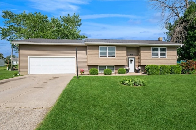 303 6th Ave, Newhall, IA 52315 - split foyer home with a garage, a front lawn, concrete driveway, and a chimney