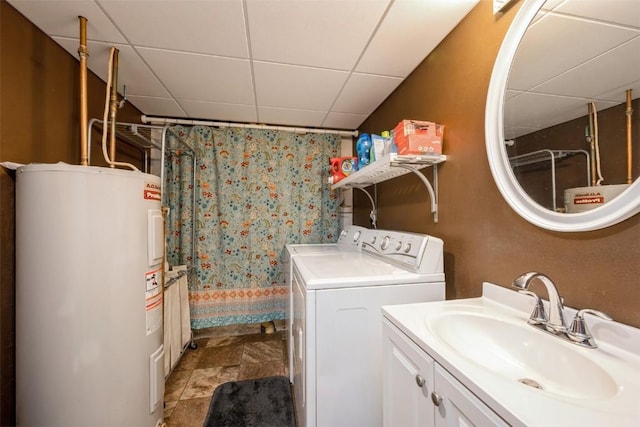 303 6th Ave, Newhall, IA 52315 - washroom with water heater and washer and dryer