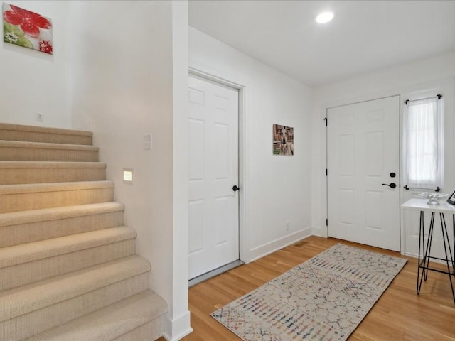 501 Washington Ct SW Unit B, Mount Vernon, IA 52314 - entrance foyer with stairway, light wood finished floors, recessed lighting, and baseboards