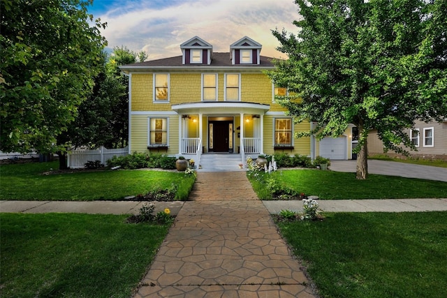 508 W 5th St, Vinton, IA 52349 - traditional style home with a porch, concrete driveway, and a garage