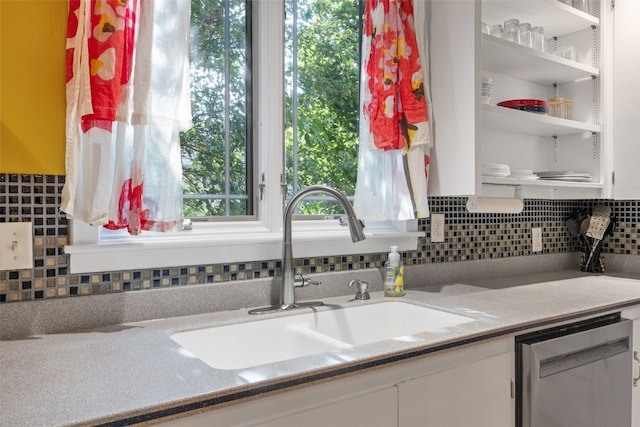 508 W 5th St, Vinton, IA 52349 - kitchen featuring a sink, stainless steel dishwasher, open shelves, and tasteful backsplash