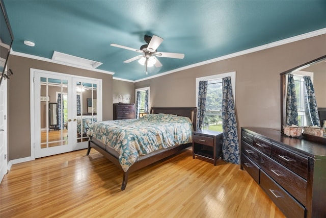 508 W 5th St, Vinton, IA 52349 - bedroom featuring light wood-type flooring, ornamental molding, ceiling fan, and french doors