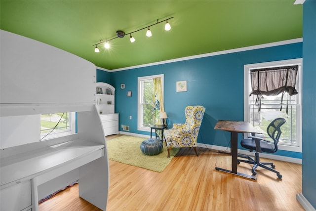 508 W 5th St, Vinton, IA 52349 - home office featuring track lighting, wood finished floors, and baseboards