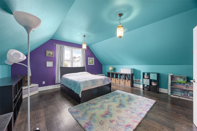 508 W 5th St, Vinton, IA 52349 - bedroom featuring wood finished floors, vaulted ceiling, and baseboards