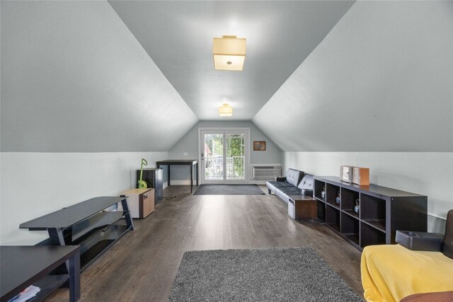 508 W 5th St, Vinton, IA 52349 - additional living space with wood finished floors, lofted ceiling, and an AC wall unit