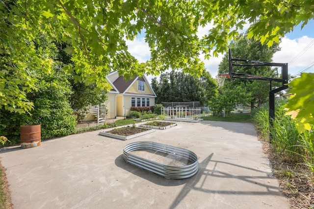 508 W 5th St, Vinton, IA 52349 - view of patio with a vegetable garden