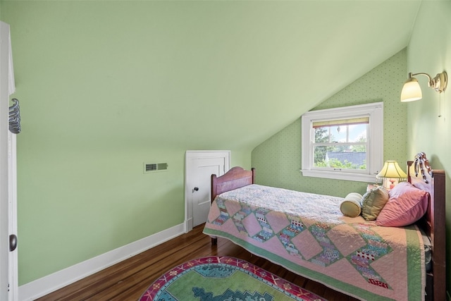 1900 Linden Dr SE, Cedar Rapids, IA 52403 - bedroom with lofted ceiling, wood finished floors, and baseboards