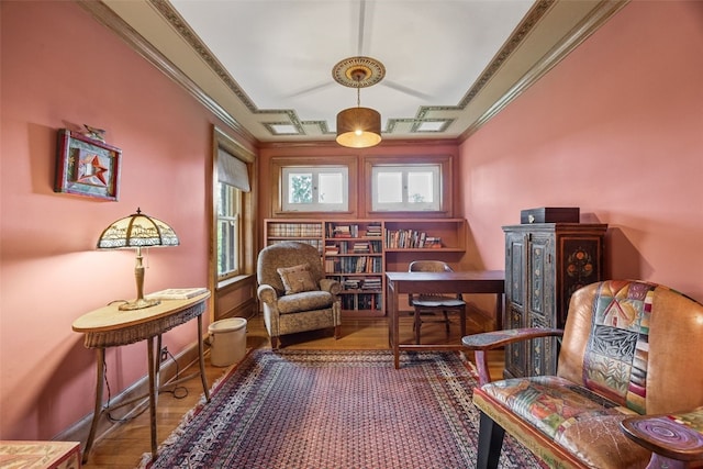1900 Linden Dr SE, Cedar Rapids, IA 52403 - sitting room with wood finished floors, crown molding, and baseboards