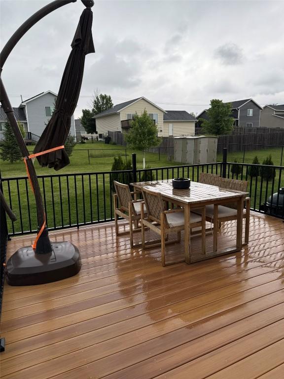 828 73rd NE, Cedar Rapids, IA 52402 - wooden terrace with outdoor dining area