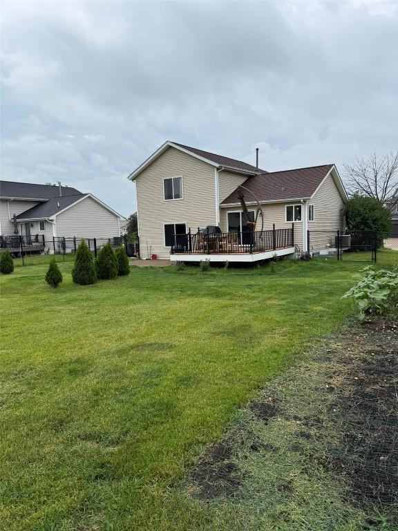 828 73rd NE, Cedar Rapids, IA 52402 - back of house featuring a wooden deck