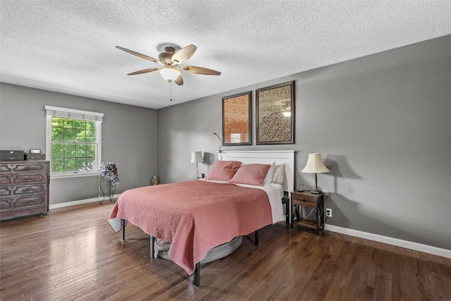 114 Tomahawk Trl SE, Cedar Rapids, IA 52403 - bedroom featuring wood finished floors, a textured ceiling, and a ceiling fan