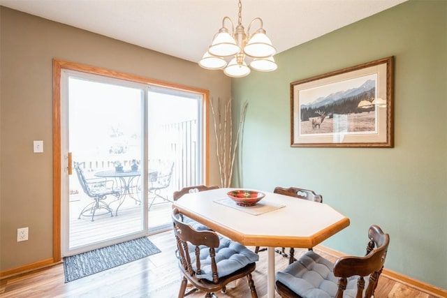 3516 Stoneview Cir, Cedar Rapids, IA 52404 - dining room with a chandelier and light wood-type flooring