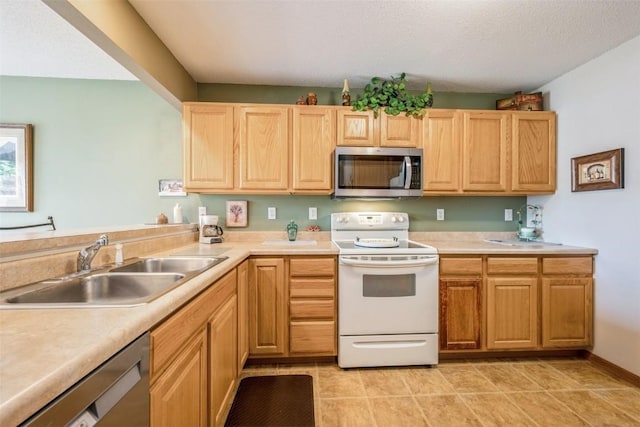 3516 Stoneview Cir, Cedar Rapids, IA 52404 - kitchen with appliances with stainless steel finishes, light countertops, light brown cabinets, and light tile patterned floors