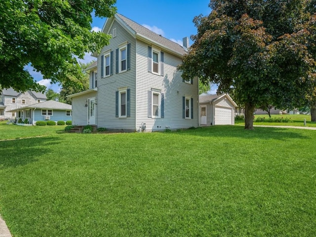 207 Prospect St NW, Blairstown, IA 52209 - view of side of home with a lawn and a detached garage