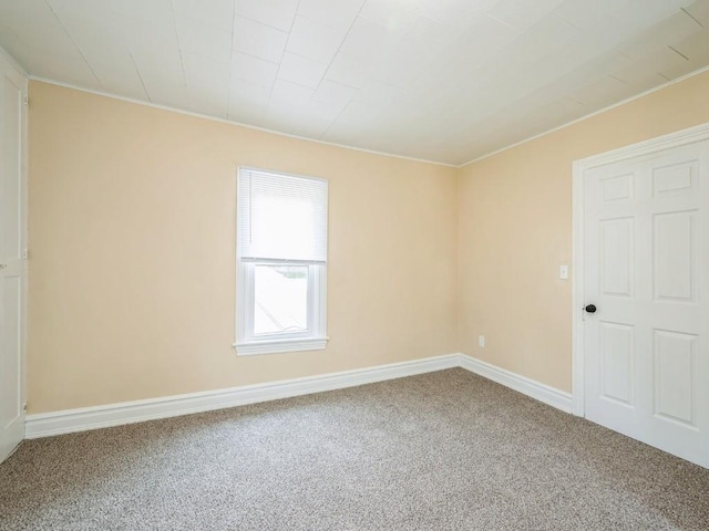 207 Prospect St NW, Blairstown, IA 52209 - empty room with carpet floors and crown molding