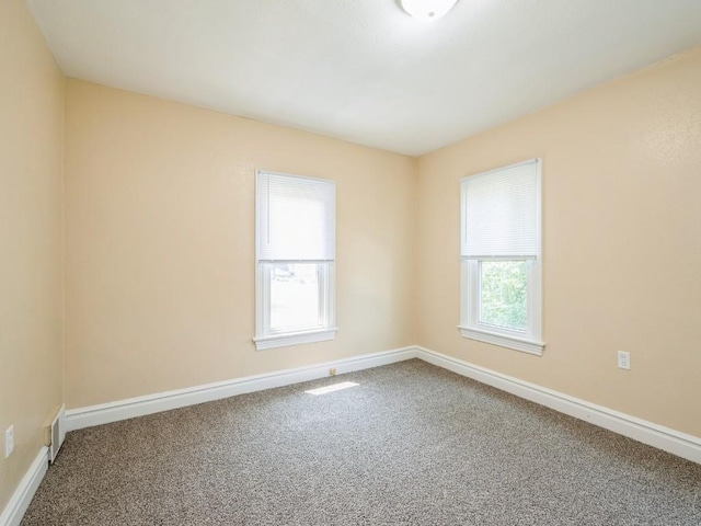 207 Prospect St NW, Blairstown, IA 52209 - carpeted empty room featuring baseboards