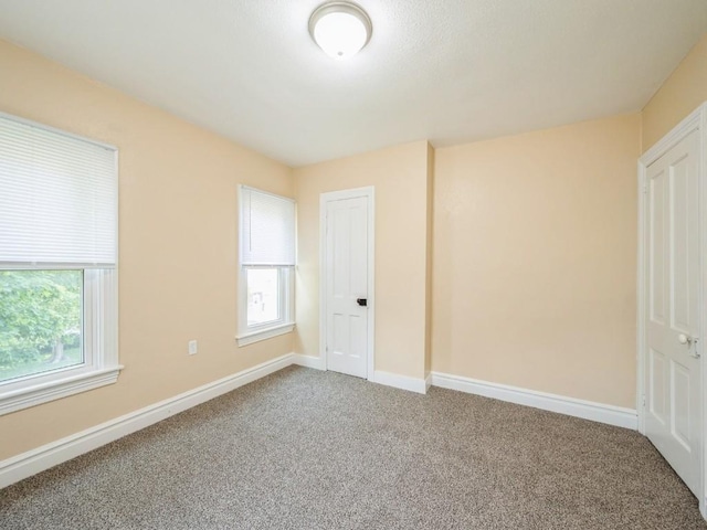 207 Prospect St NW, Blairstown, IA 52209 - unfurnished bedroom with carpet floors and baseboards