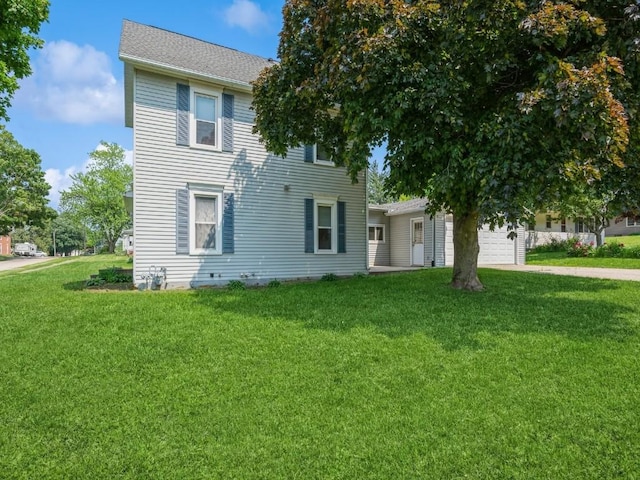 207 Prospect St NW, Blairstown, IA 52209 - view of front of property featuring an attached garage, a front lawn, driveway, and a shingled roof