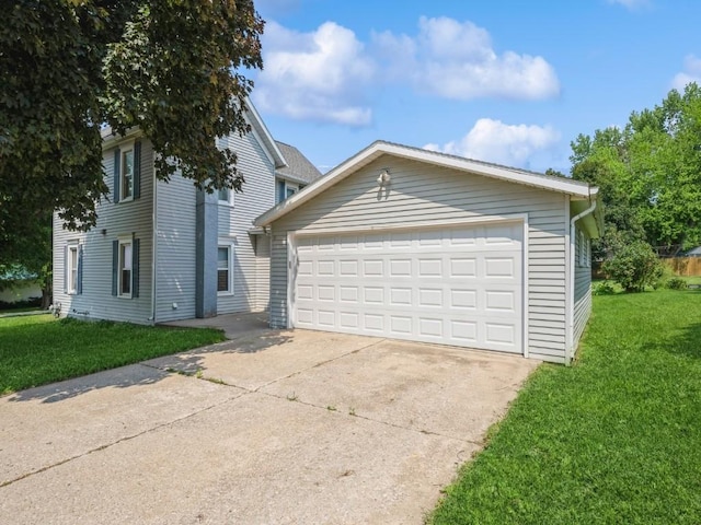 207 Prospect St NW, Blairstown, IA 52209 - view of front of property featuring a garage and a front lawn