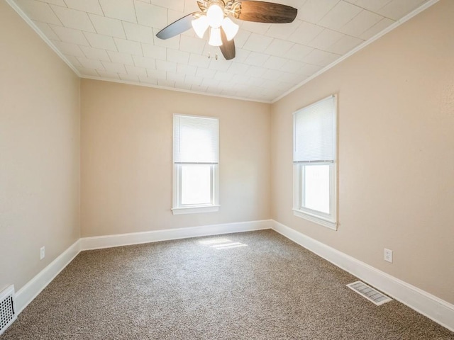207 Prospect St NW, Blairstown, IA 52209 - carpeted empty room with crown molding, healthy amount of natural light, and a ceiling fan