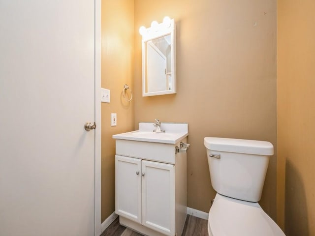 207 Prospect St NW, Blairstown, IA 52209 - bathroom with vanity and wood finished floors