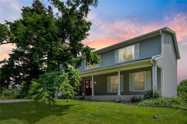 6908 Larkwood Dr NE, Cedar Rapids, IA 52402 - view of front of property with a yard and covered porch