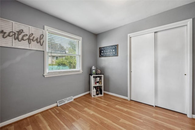 3622 14th Ave SE, Cedar Rapids, IA 52403 - unfurnished bedroom featuring wood finished floors and a closet