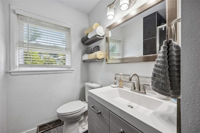 3622 14th Ave SE, Cedar Rapids, IA 52403 - bathroom featuring vanity and a textured wall