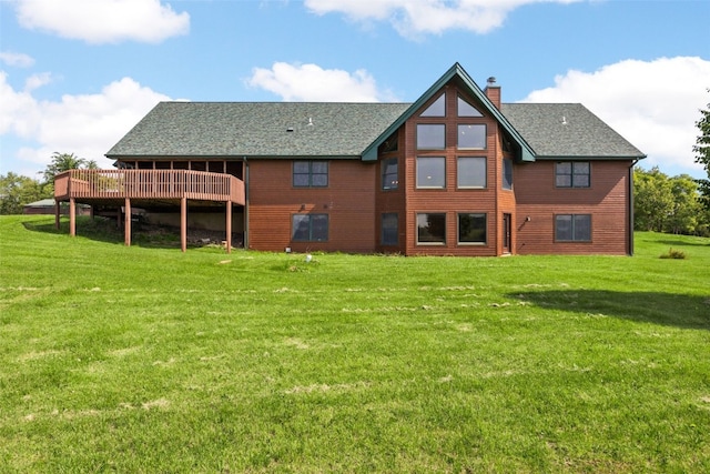 660 Garfield Rd, West Branch, IA 52358 - back of house with a chimney, a yard, a wooden deck, and a shingled roof