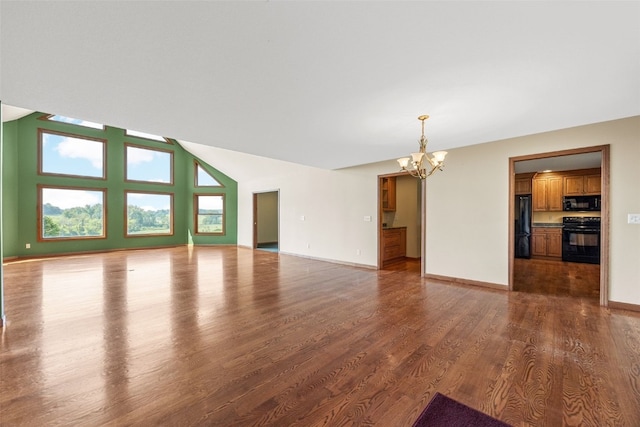 660 Garfield Rd, West Branch, IA 52358 - unfurnished living room with a chandelier and wood finished floors