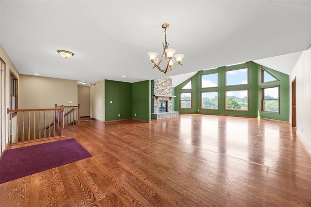 660 Garfield Rd, West Branch, IA 52358 - unfurnished living room with a chandelier, wood finished floors, and lofted ceiling