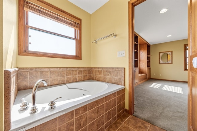 660 Garfield Rd, West Branch, IA 52358 - full bath with a jetted tub, tile patterned floors, healthy amount of natural light, and recessed lighting