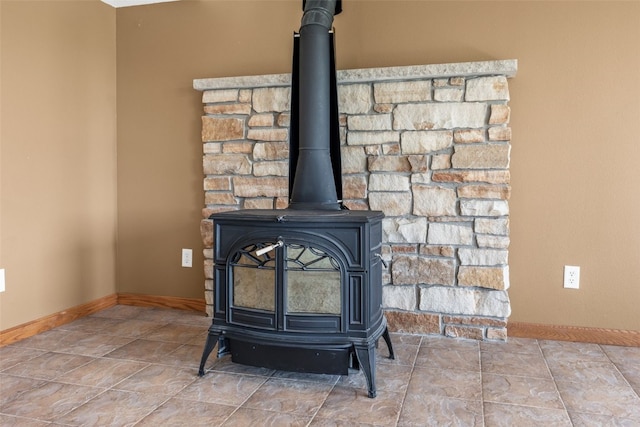 660 Garfield Rd, West Branch, IA 52358 - detailed view of a wood stove and baseboards
