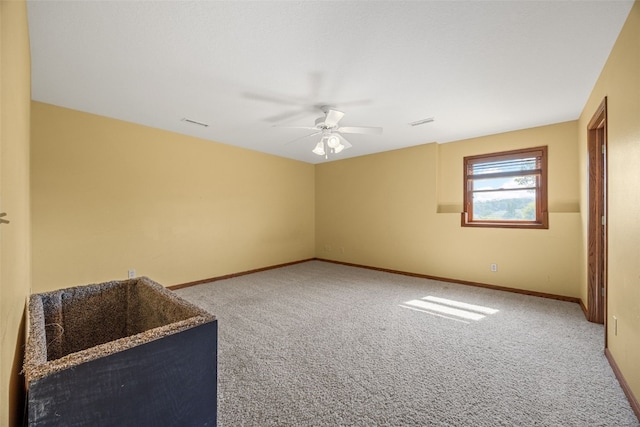 660 Garfield Rd, West Branch, IA 52358 - unfurnished room featuring carpet floors and ceiling fan